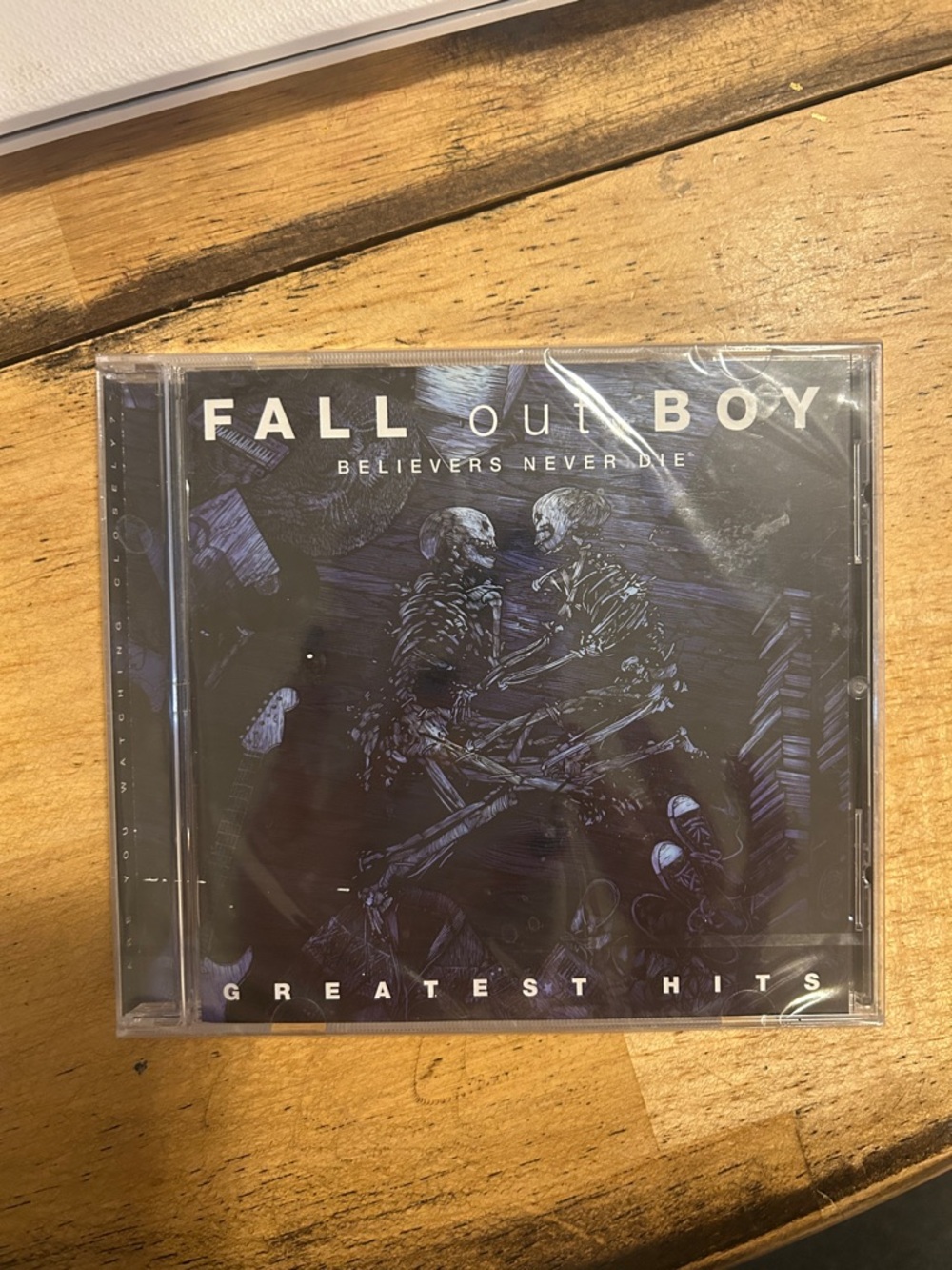 Fall Out Boy - Believers Never Die: Greatest Hits CD (Black/Purple Artwork)